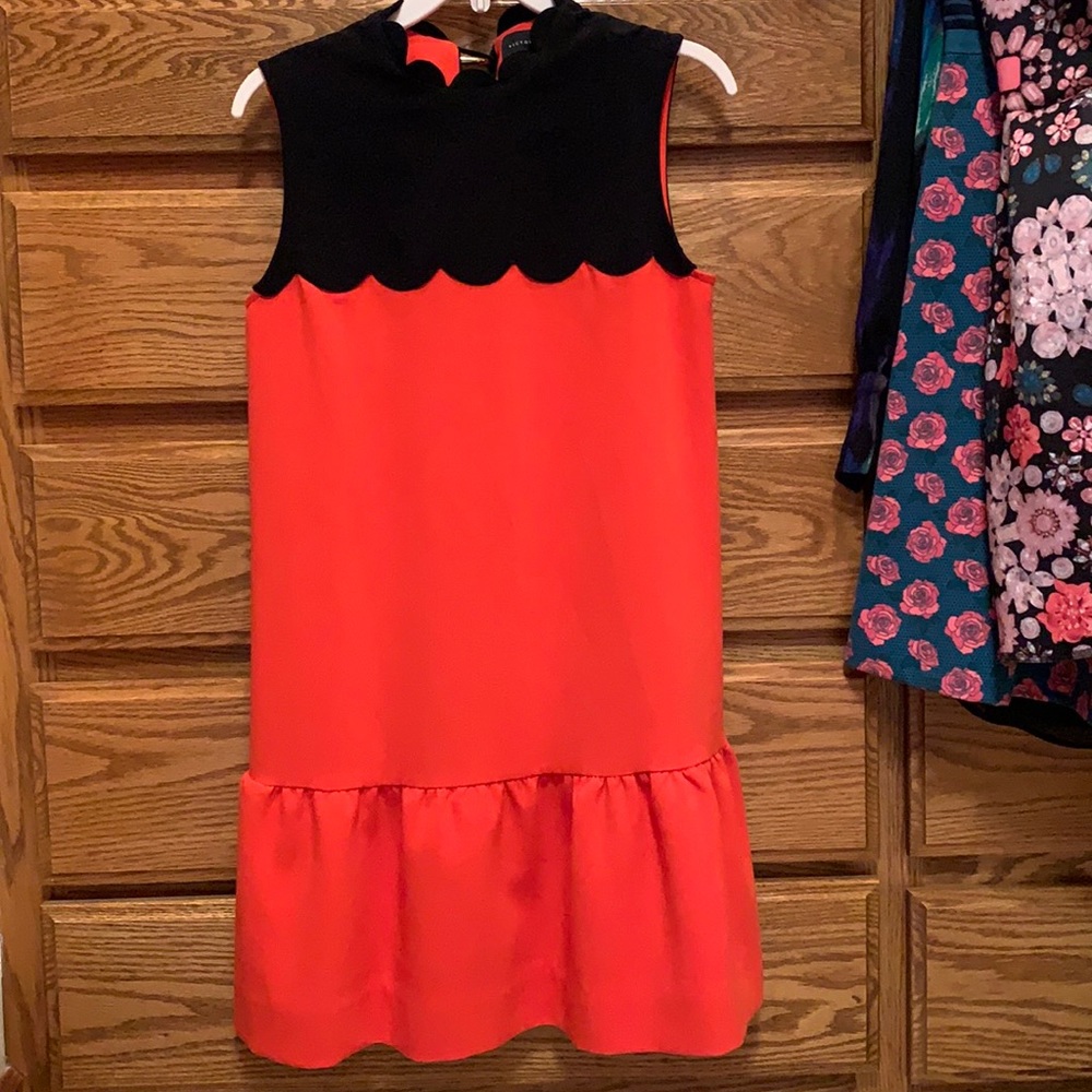 Orange and black scallop dress